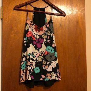 Reversible tank top. Floral one side, black other